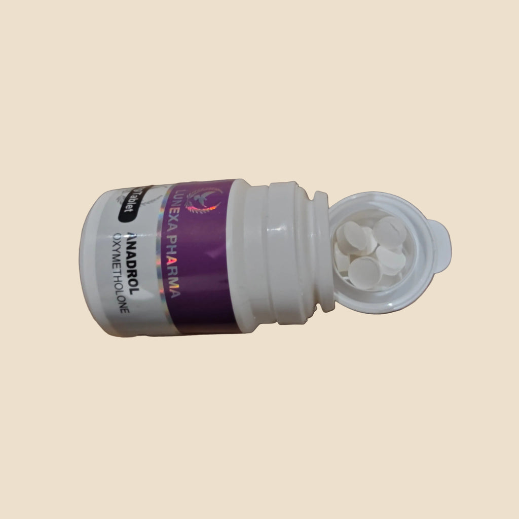 Open white pill bottle with purple label on a wooden surface