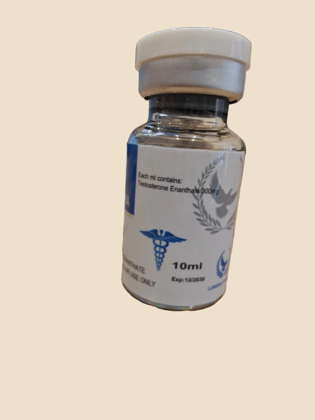 Vial labeled '10ml' with a blue and white label on a wooden surface.