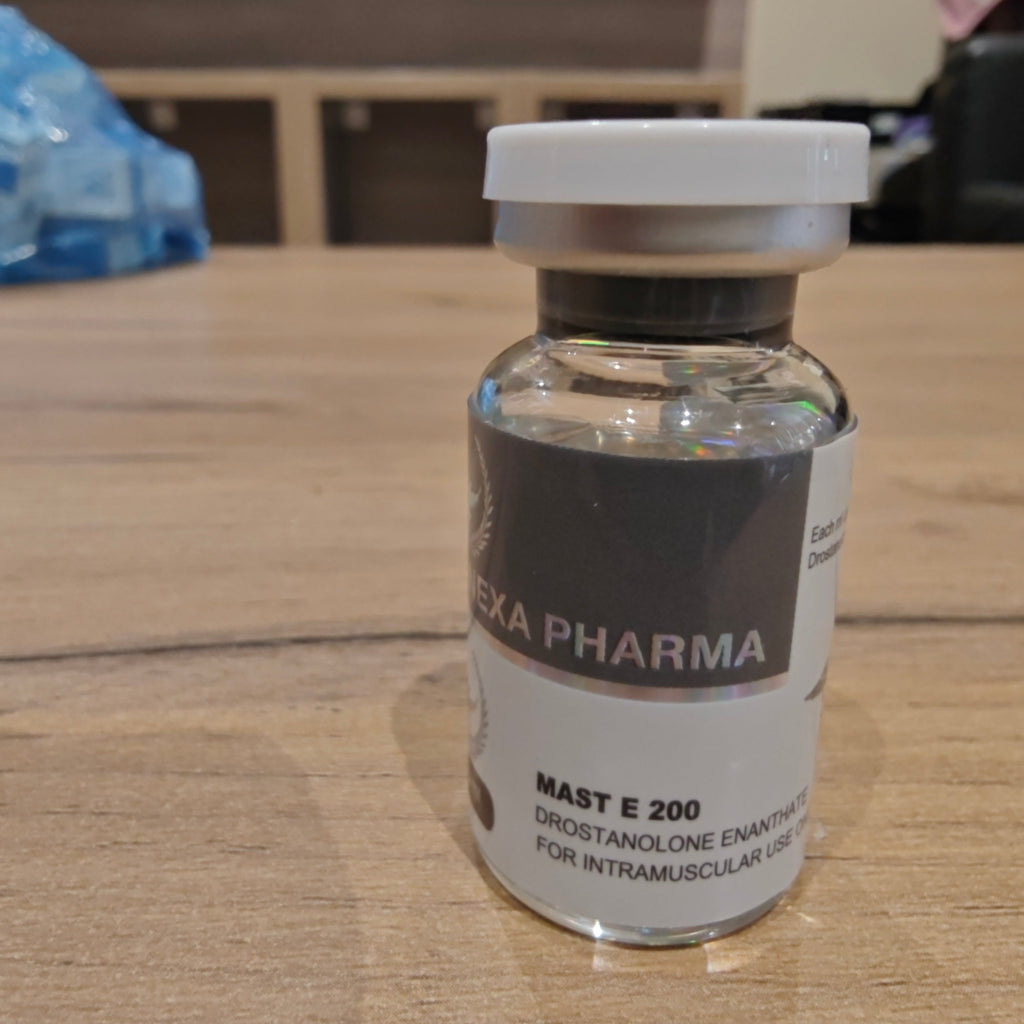 Vial labeled 'Hexa Pharma' on a wooden surface