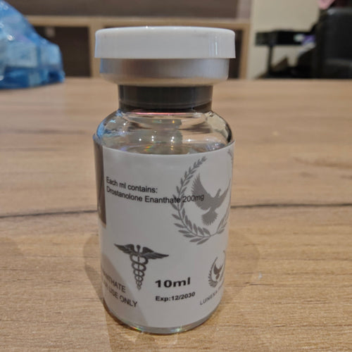 Vial with a label on a wooden surface